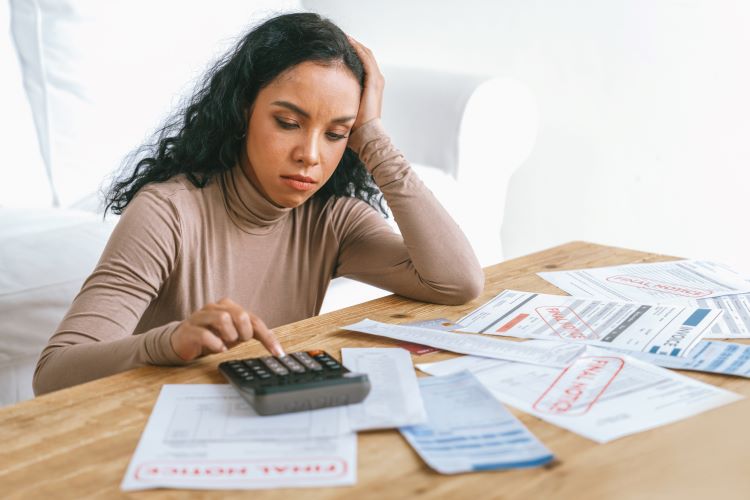 Stressed out woman doing her taxes. 