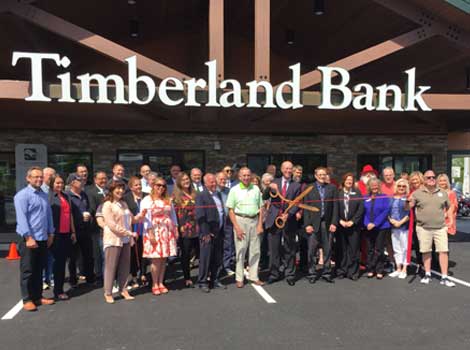Employees and friends at the ribbon cutting of Timberland's new branch in Edgewood