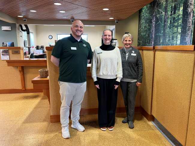 Timberland Bank staff smiling for a picture at the Gig Harbor location.