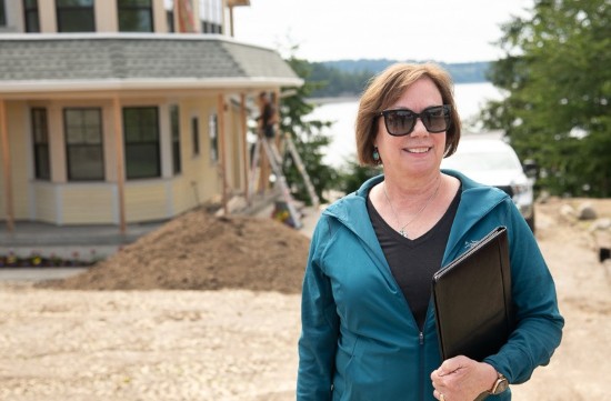 Timberland Bank Loan Officer, Linda Wark standing out front of a construction site.