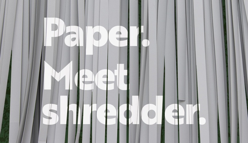 Photo of paper being shredded with the title, "Paper. Meet shredder".