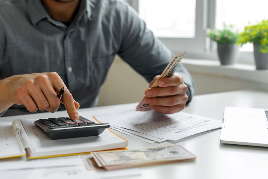 Man using a calculator. 